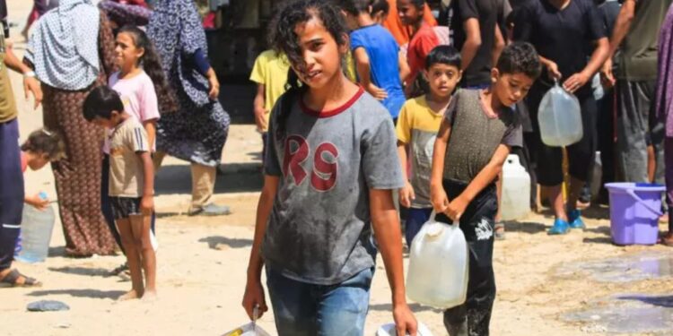 Palestinian children carrying water containers in a Gaza refugee camp under the summer sun, highlighting the region's clean water crisis.