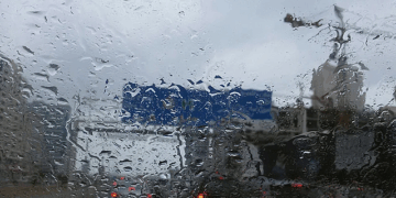 Dense fog, heavy rain, and high temperatures across UAE cities including Dubai and Abu Dhabi with weather warning symbols