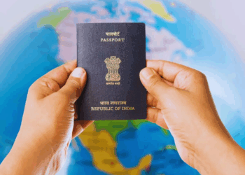 Indian passport with stamps and world map showing rise in global travel rankings.