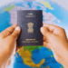 Indian passport with stamps and world map showing rise in global travel rankings.