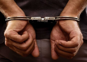 Sharjah Police officers stand beside large quantities of seized drugs, totaling 1,240kg, during a press event marking the UAE’s ongoing war against narcotics in 2024.