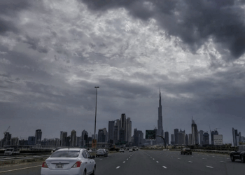 Dense fog on Abu Dhabi roads with cars driving slowly in low visibility