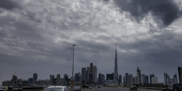 Dense fog on Abu Dhabi roads with cars driving slowly in low visibility