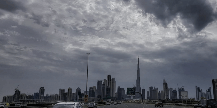 Dense fog on Abu Dhabi roads with cars driving slowly in low visibility